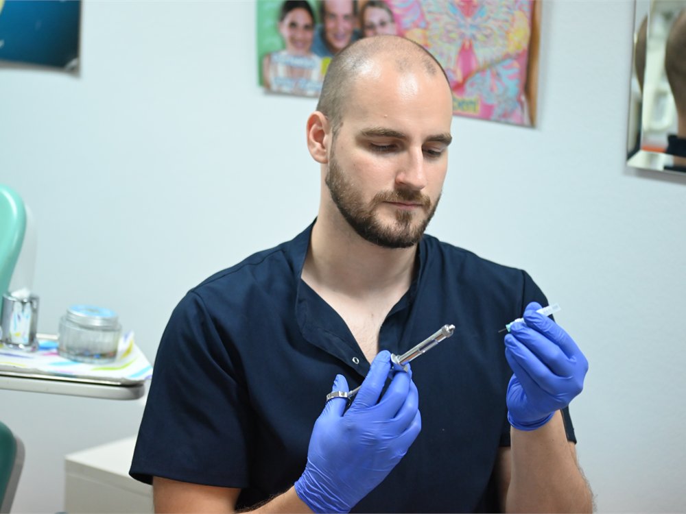 Dr Miloš Paštrmac preparing a dental instrument
